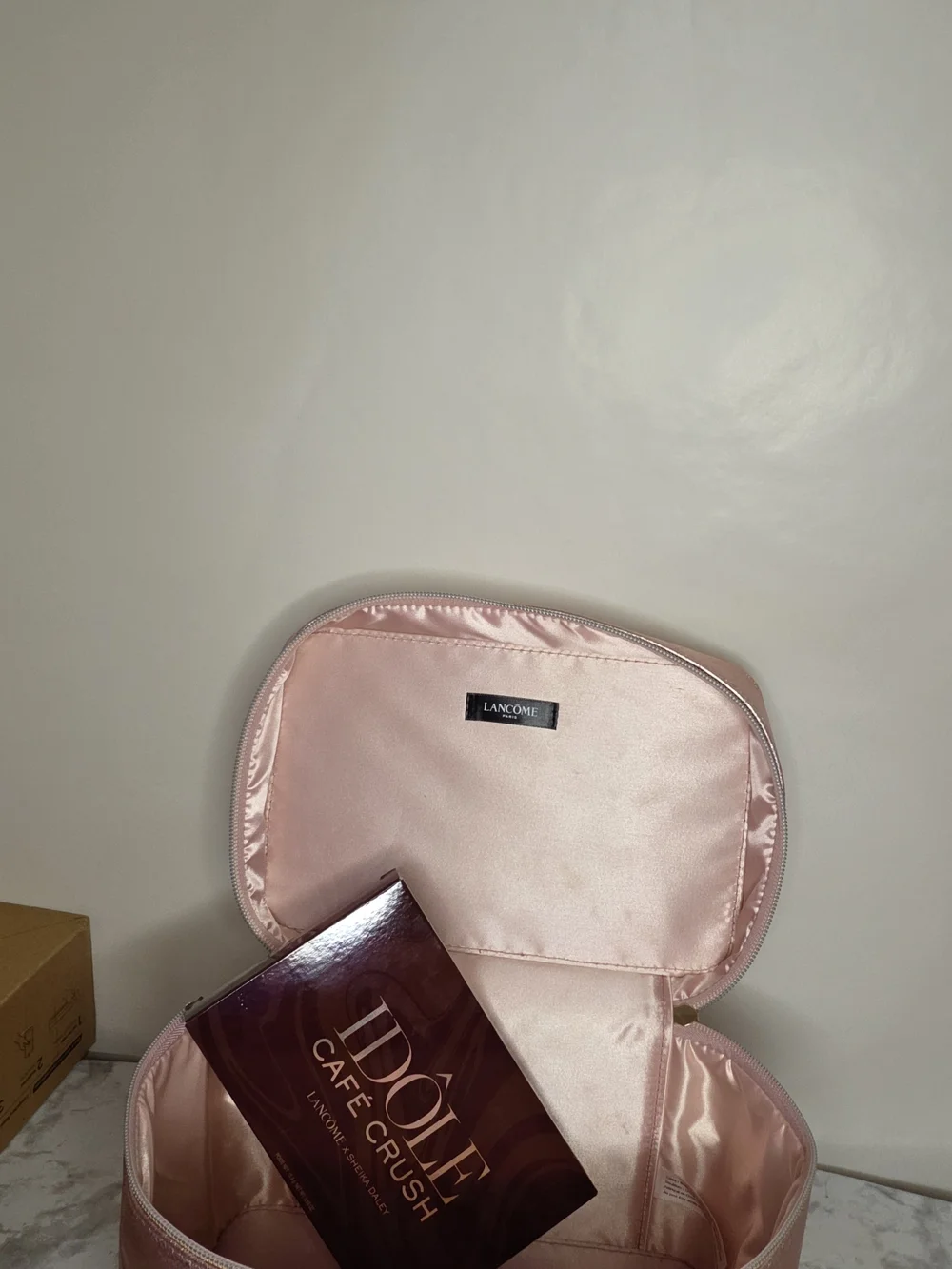 Lancome cute travel case for metallic pink makeup along with a palette of neutra